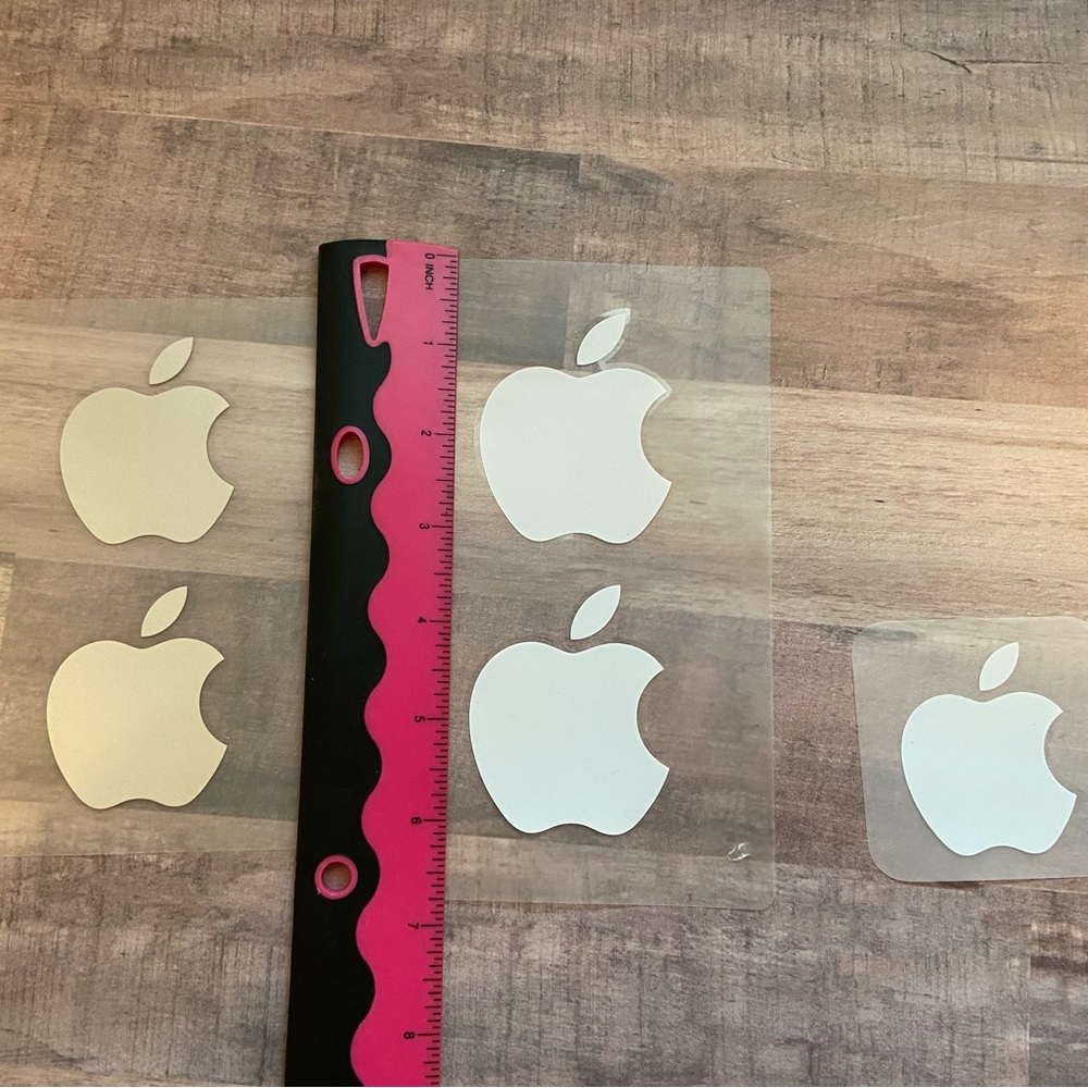5 Apple stickers from iPad and iPhone. 3 white and 2 silver